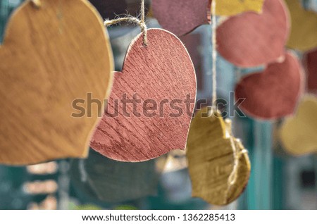 Set of decorative wooden hearts hanging in the shop.