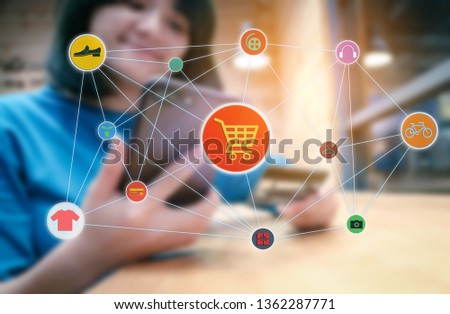 Online shopping concept.Blurred of female using mobile phone and holding credit card