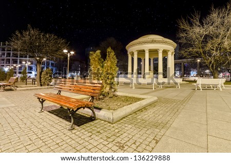 Skopje marble romantic monument and bench on dark star night, Macedonia