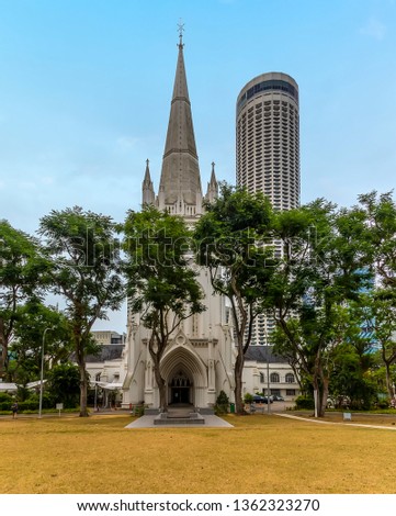A view of the contrast between the traditional of St Andrew's Cathedral and modern skyscraper in Singapore, Asia