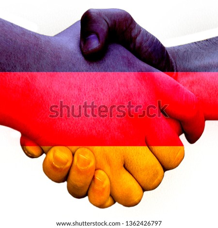 Gesture made by the flag Germany with colored hands showing friendship with a handshake isolated on a white background in a square