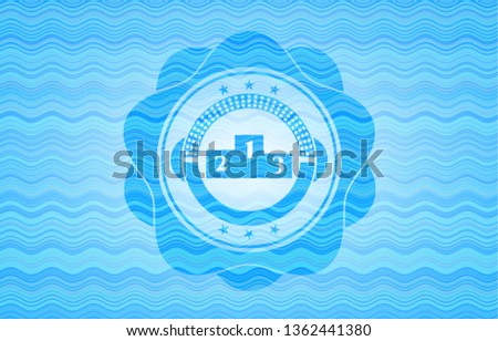 podium icon inside water concept style emblem.
