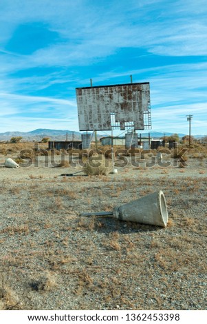 Abandoned drive in theatre and overgrown parking area Royalty-Free Stock Photo #1362453398