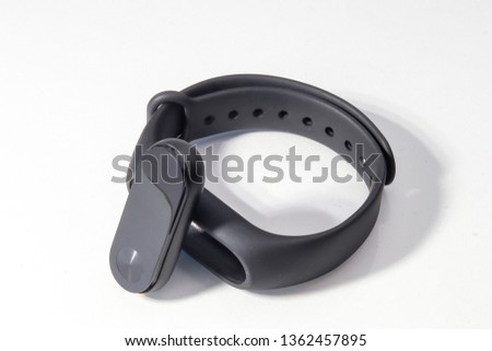 Modern  light weight digital watch technology in black color over white background.