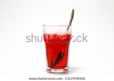 Delicious red rosary drink over white background.