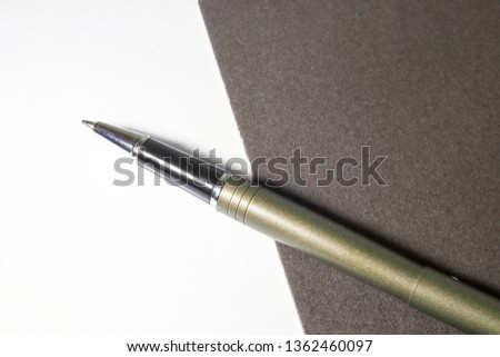 luxury black ball pen for business and notes. Business and education concept.