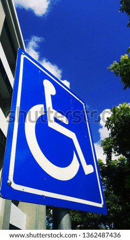 Symbol for wheelchair users or for disability around campus parking