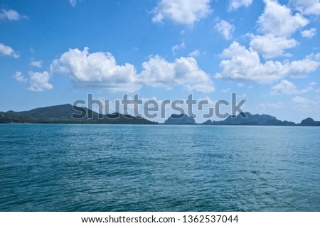 Cloudy sky over islands and sea