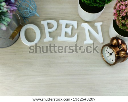 open wooden letter alphabet on wooden background