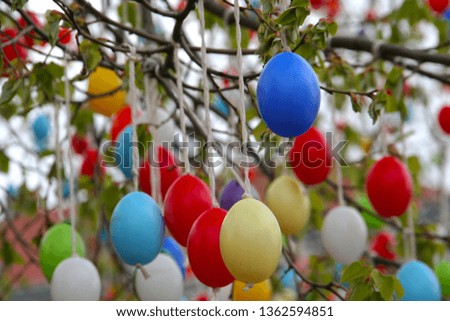 Traditional eastern tree with colorful eggs holiday decoration background