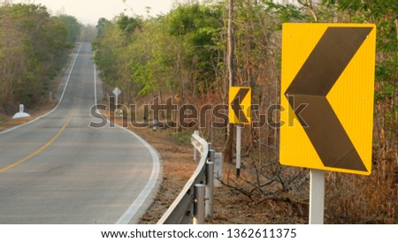 Warning, The Road Turned Left And Right Yellow And White Road Sign