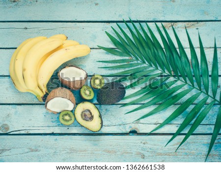 Exotic fruits on a wooden background/toned photo