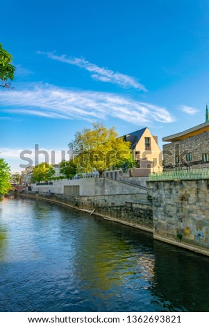Town hall in Hannover behind Leine creek, Germany