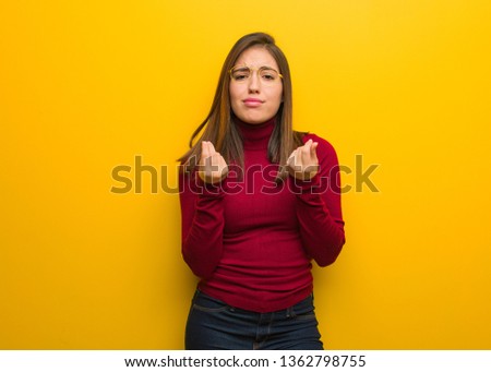 Young intellectual woman doing a gesture of need