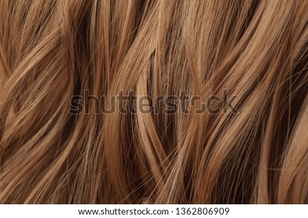 multiple pieces clip in wavy reddish brown synthetic hair extensions Royalty-Free Stock Photo #1362806909