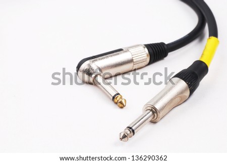 guitar cable audio jack on isolated white background