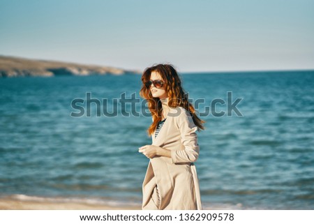 Elegant woman on nature near the ocean on the beach vacation summer relax