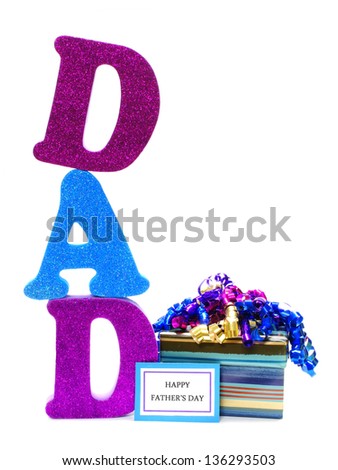 Shiny letters spelling DAD with gift box and Happy Fathers Day tag