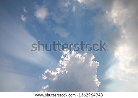 View of clouds in blue sky with rays of light - Image