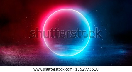 Empty dark street, reflection of neon light in the puddles of the night city. Neon circle in the center, magical glow, light, rays, smoke. Royalty-Free Stock Photo #1362973610