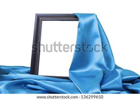 close up of a black wooden frame covered with blue silk on white background with clipping path