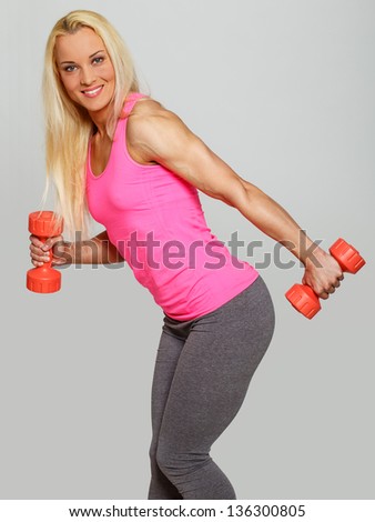 Image of pumped blondie with weights