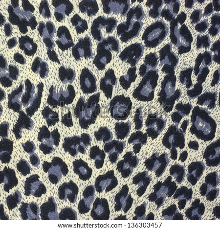 Leopard spots background with fabric texture