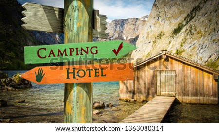 Street Sign Camping versus Hotel