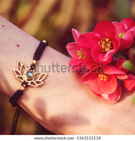 Lotus metal component labradorite stone bracelet on female wrist
