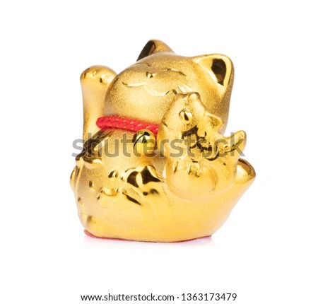 figurine golden cat brings good luck isolated on white background