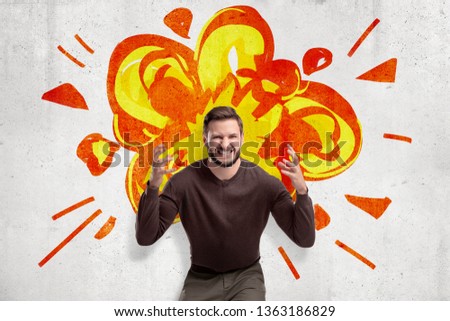 Young man in casual clothes making brain explosion gesture with cartoon explosion drawn on white wall background. People and objects. Feelings and emotions. Digital art.