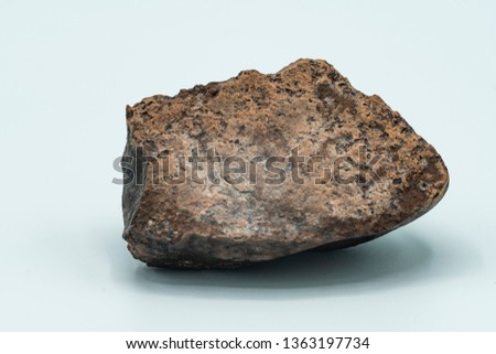 Chondrite Meteorite isolated, a piece of rock formed in outer space in the early stages of Solar System as asteroids. This meteorite comes from a meteorite fall impacting the Earth at Atacama Desert