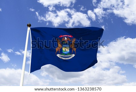 Michigan flag mock-up in the wind. State of the Midwest USA. The largest city is Detroit, famed for being the seat of the automotive industry and Hitsville U.S.A. the headquarters of the Motown label.