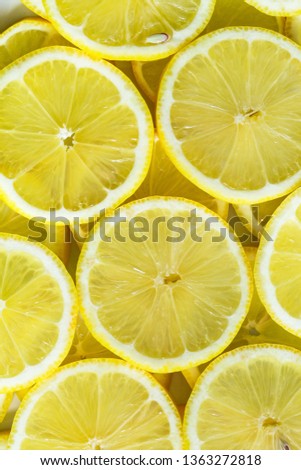 Lemon slices closeup, macro food summer background, fruits top view. Pantone color of 2021 - Illuminating Yellow 