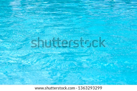 Blue swimming pool rippled water detail 