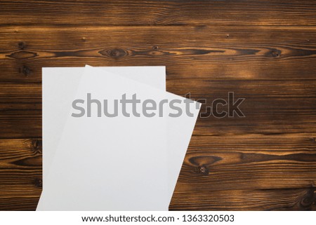 Blank paper sheets on  wooden background - Image