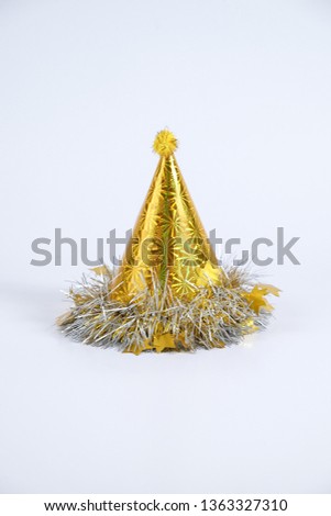 Gold glittering party hat isolated on white background