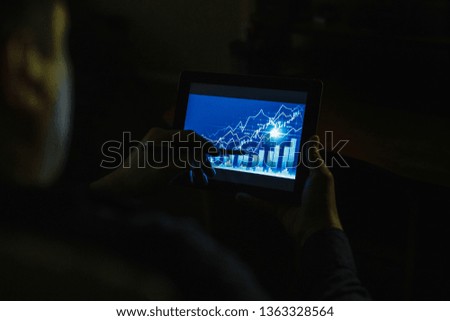 A person pursuing a stock market or a trading chart on forex in a graphical concept suitable for financial investment or business ideas and all art work. Abstract financial background