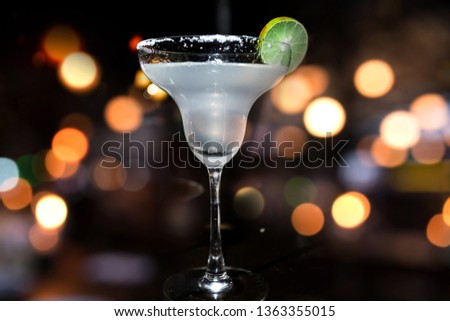cocktail glass at bar. 