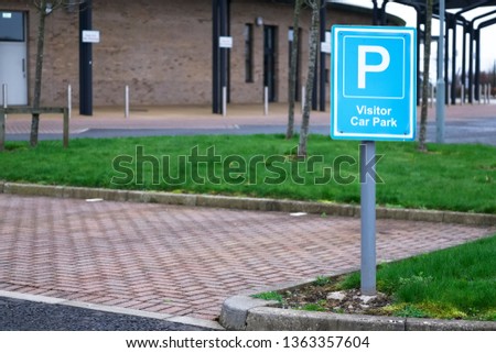Visitor car park space at school grounds sign