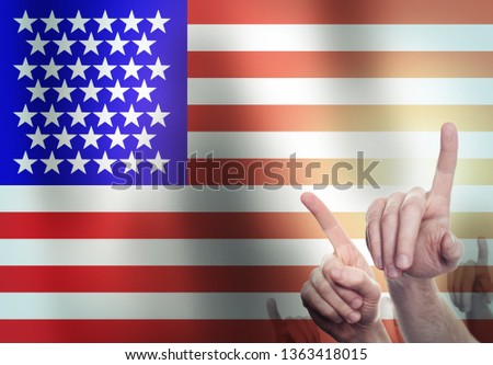 Hands on the background of the USA flag. Freedom concept