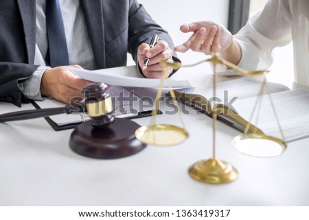 Businesswoman and Male lawyer or judge consult and conference having team meeting with client at law firm in office, Law and Legal services concept. Royalty-Free Stock Photo #1363419317