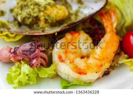fish restaurant, vegetarian, pescetarian. delicious fresh salad with seafood, appetizing starter