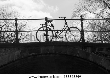 Bicycle on a bridge over a canal in Amsterdam (Black&White picture)