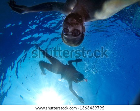 Underwater selfie of two person.