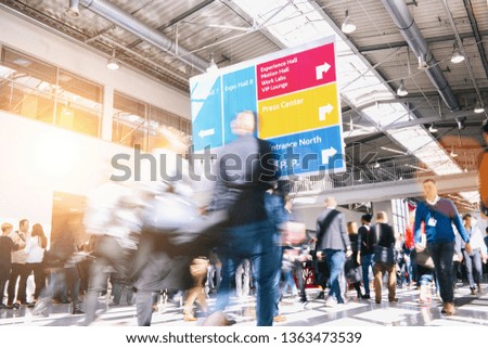 Business People Walking on a trade show hall