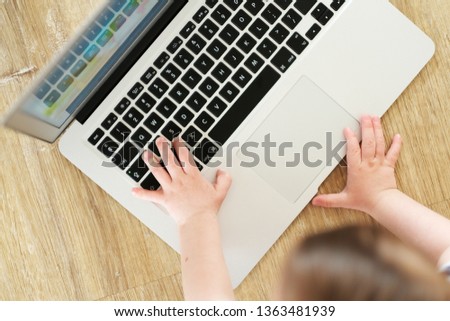 Kids hands on keyboard. Little hacker.