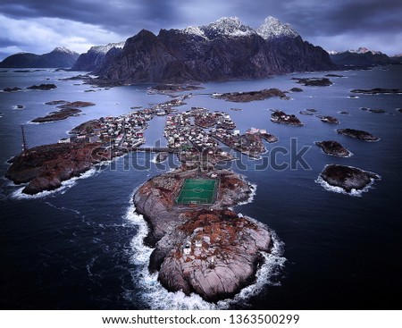 Henningsvaer - Moody day for a game of Football in Norways Lofoten Islands.