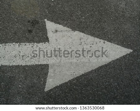 on road arrow sign