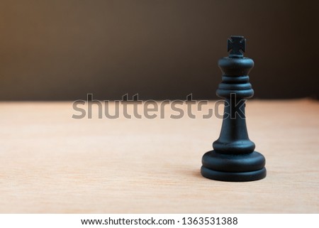 Black chess king with black background